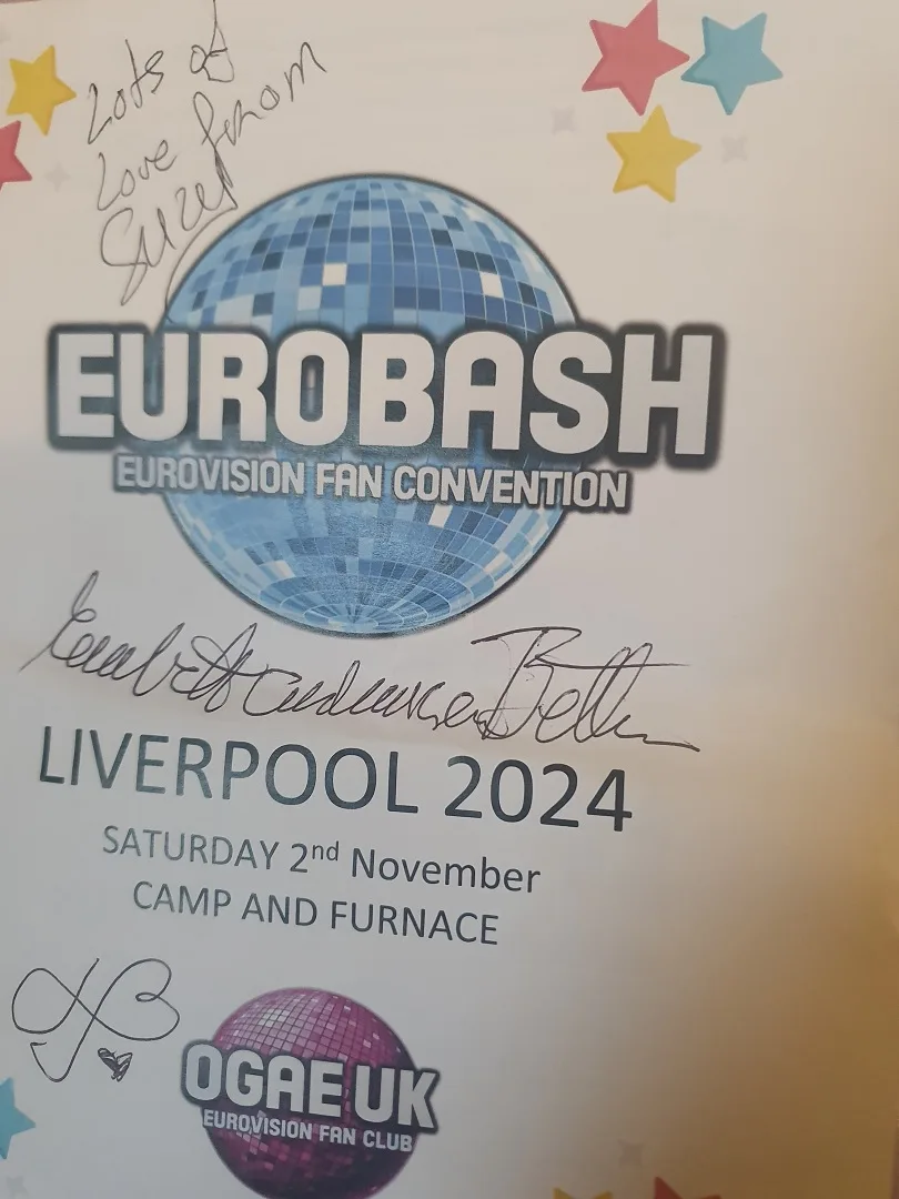 A signed Eurobash 2024 event poster for the Eurovision Fan Convention in Liverpool, featuring a disco ball logo and…