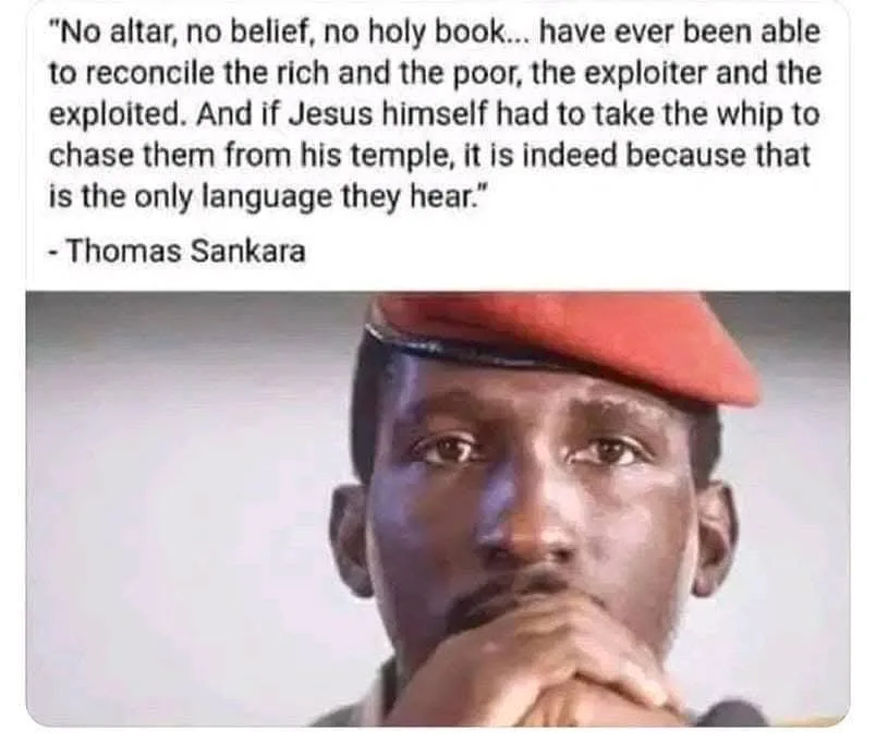 A close-up image of Thomas Sankara wearing a red beret, looking intently forward with his hands clasped under his chin…