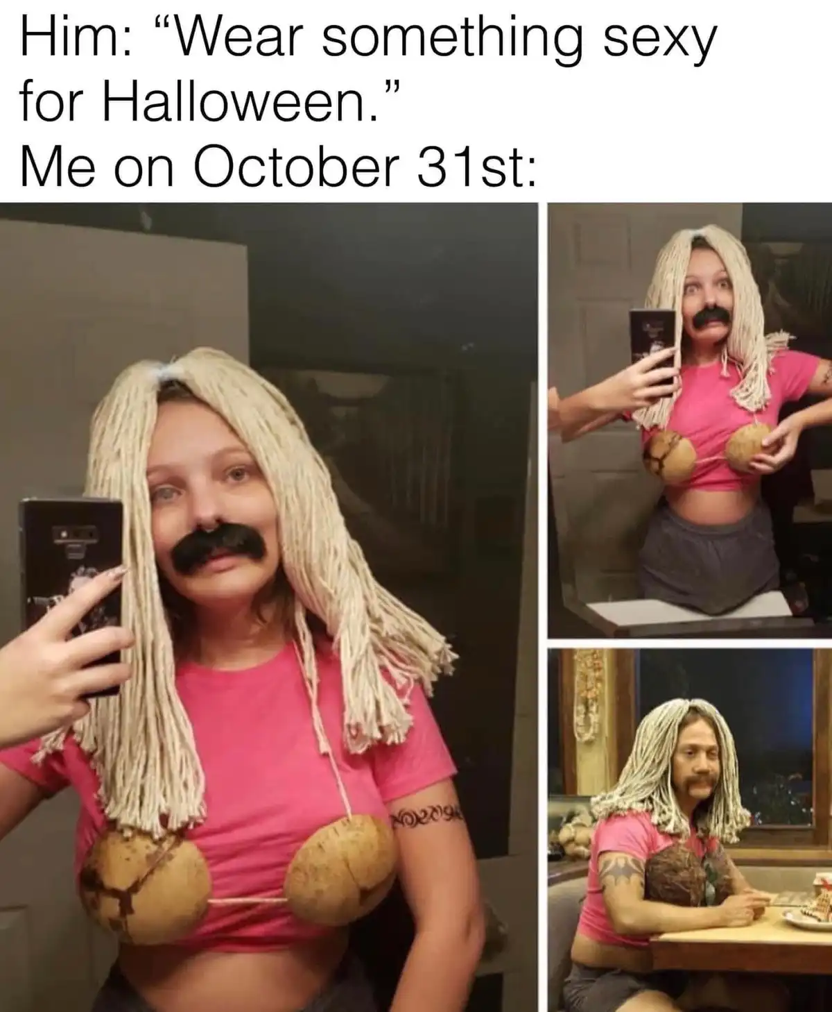 A woman takes selfies in a mirror wearing a pink crop top, grey shorts, a blonde rope wig, and a fake mustache, using two…