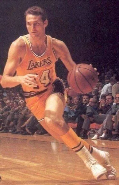 A vintage photo of a basketball player in a yellow Lakers jersey with the number 4 dribbling a ball on a court, with…
