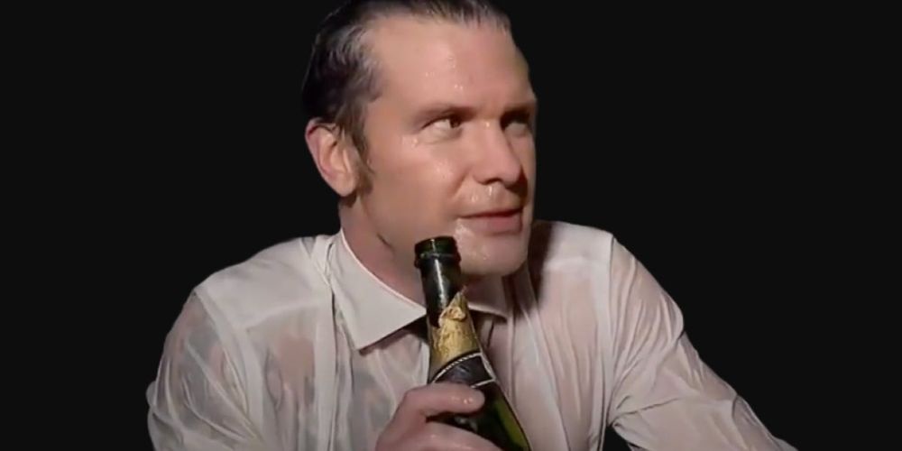a man in a white shirt holding a bottle, visibly sweaty and looking sideways with a slight smirk, overlaid with the text…