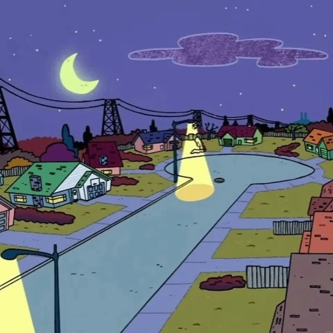 A cartoon suburban street at night under a crescent moon, with a single streetlamp casting a bright cone of light down an…