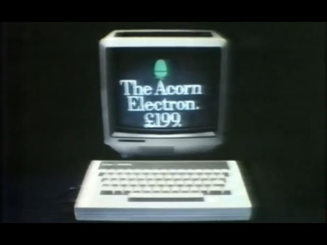 A vintage advertisement for the Acorn Electron computer, showing the beige machine with a small screen displaying the text…