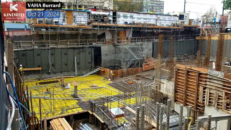 An aerial view of a construction site on October 21, 2024, showing a partially built structure with scaffolding, exposed…