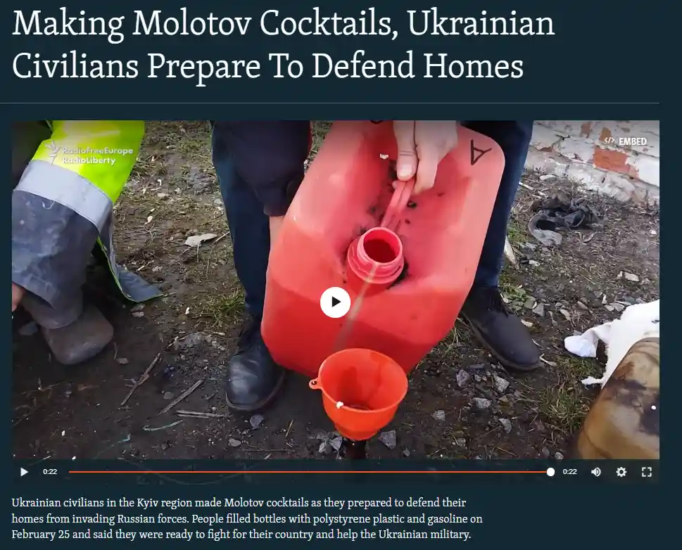 A video still shows a person pouring liquid from a red plastic jerrycan into a smaller orange funnel on muddy ground…