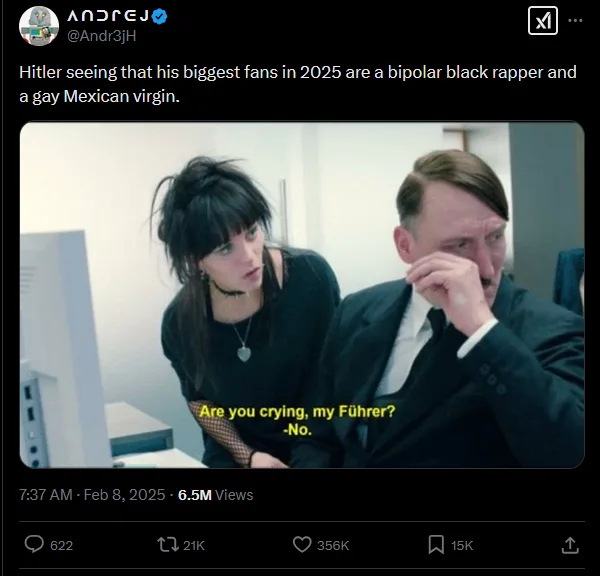 A still from a video shows a man in a suit, resembling Adolf Hitler, wiping his eye while a woman with dark hair and a…