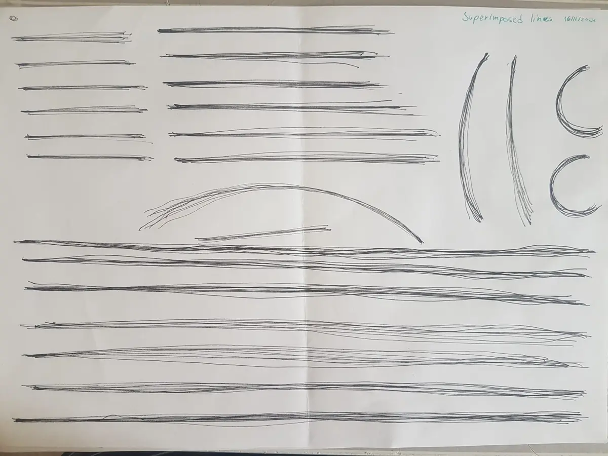 A white sheet of paper displays numerous hand-drawn, overlapping black lines in various orientations and densities, with the…
