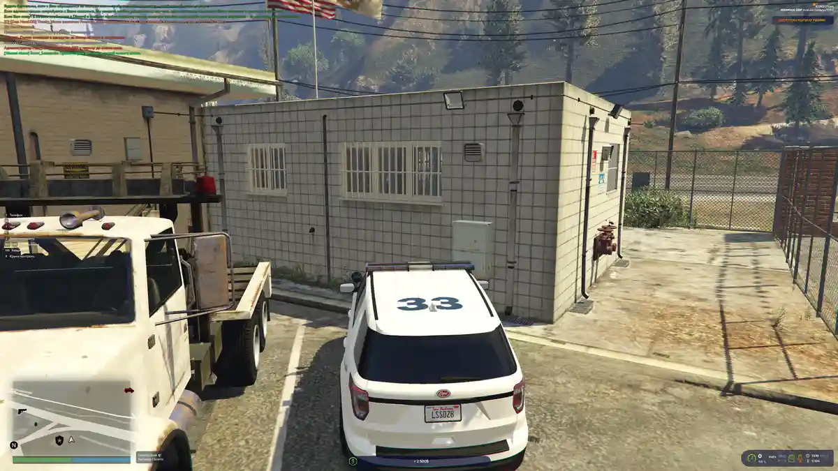 A screenshot from the video game Grand Theft Auto Roleplay shows a white police SUV with the number 33 on its roof parked…