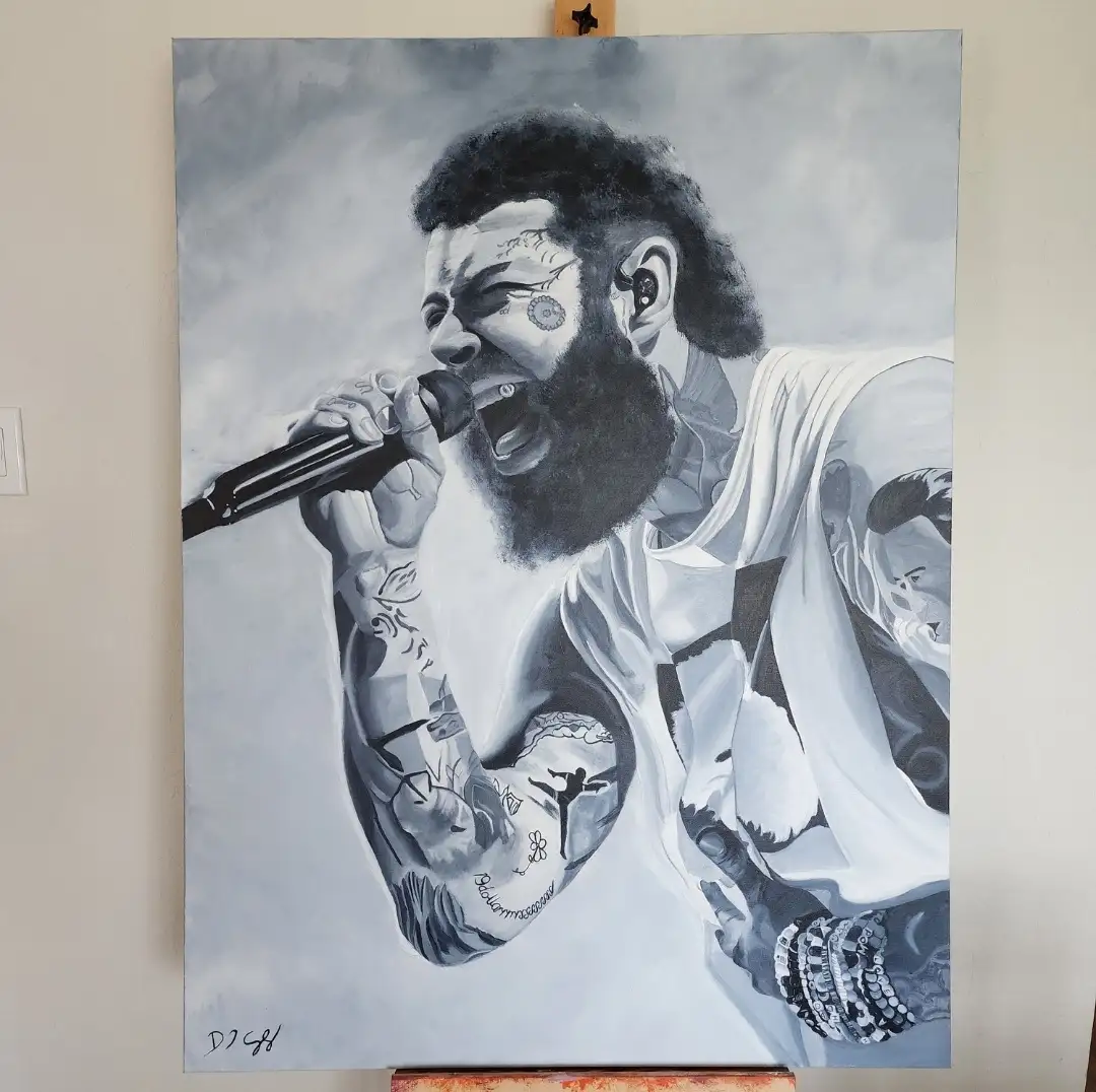 A black-and-white painting of a tattooed man with a beard, holding a microphone and singing passionately, displayed on an…