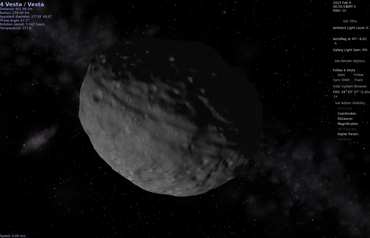 A screenshot from a space simulation program shows the asteroid 4 Vesta, a large, irregularly shaped, cratered gray rock…
