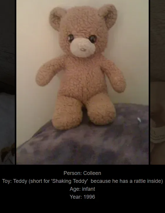 A brown, fluffy teddy bear with black button eyes and a white snout sits upright on a purple patterned surface against a…