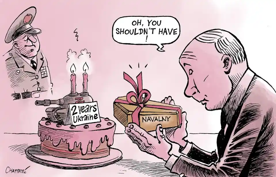 A cartoon depicts Vladimir Putin holding a gift box labeled 'NAVALNY' while looking at a birthday cake shaped like a tank…