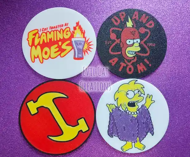 Four circular badges are arranged on a glittery purple surface. The top-left badge is white with red and yellow text reading…