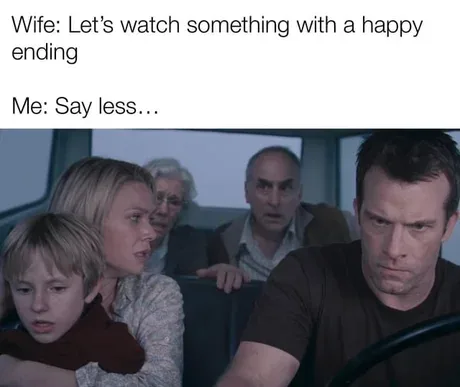 A still from a movie shows a woman holding a child, both looking alarmed, while a man in the foreground stares intensely…