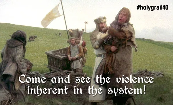 A scene from Monty Python's Holy Grail shows a knight holding a large, furry animal while another knight looks on. A third…
