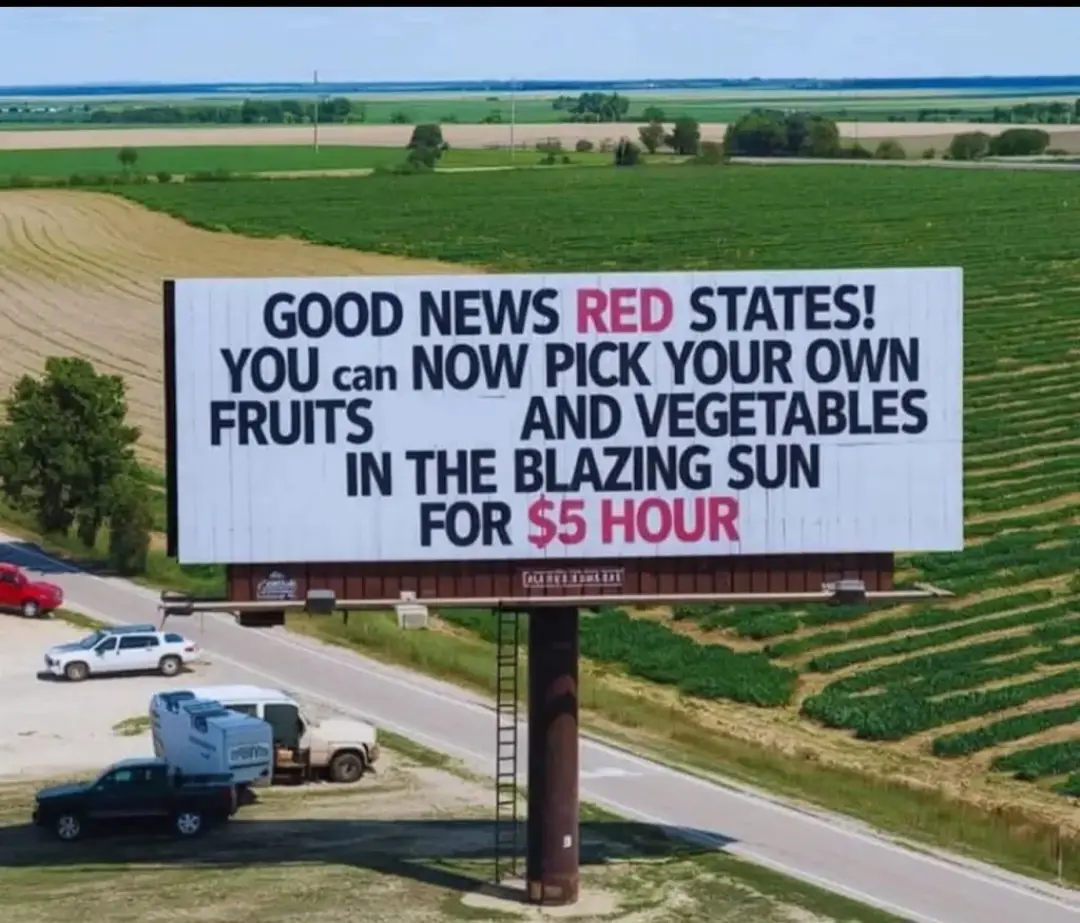 A large white billboard stands beside a rural road with fields in the background. The text on the billboard reads 'GOOD NEWS…