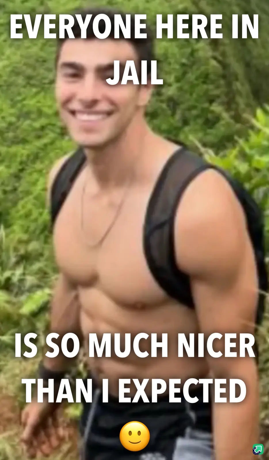 A shirtless man with a backpack smiles broadly while standing outdoors in green foliage. White bold text overlays the image…