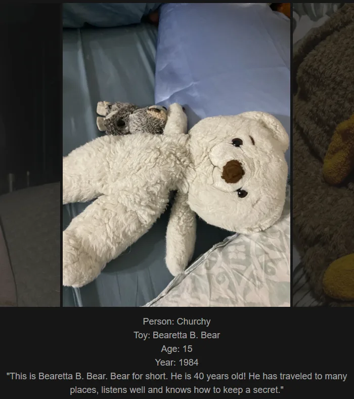 A white teddy bear lies on a bed, with a smaller grey stuffed animal tucked under its arm. Text overlaid at the bottom…