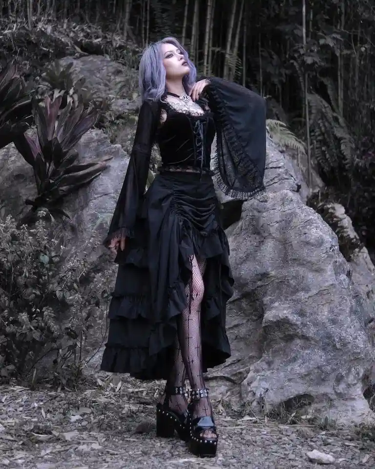 Admiring her stunning dress and stylish tights