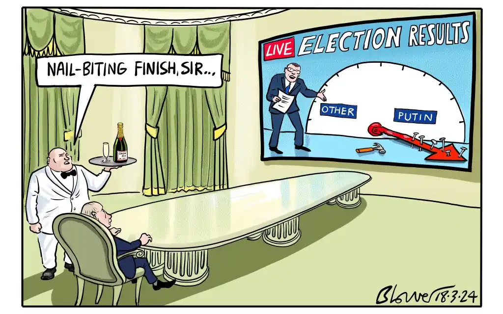 A cartoon depicts a man in a suit sitting at a long table, looking at a large screen showing 'LIVE ELECTION RESULTS'. The…
