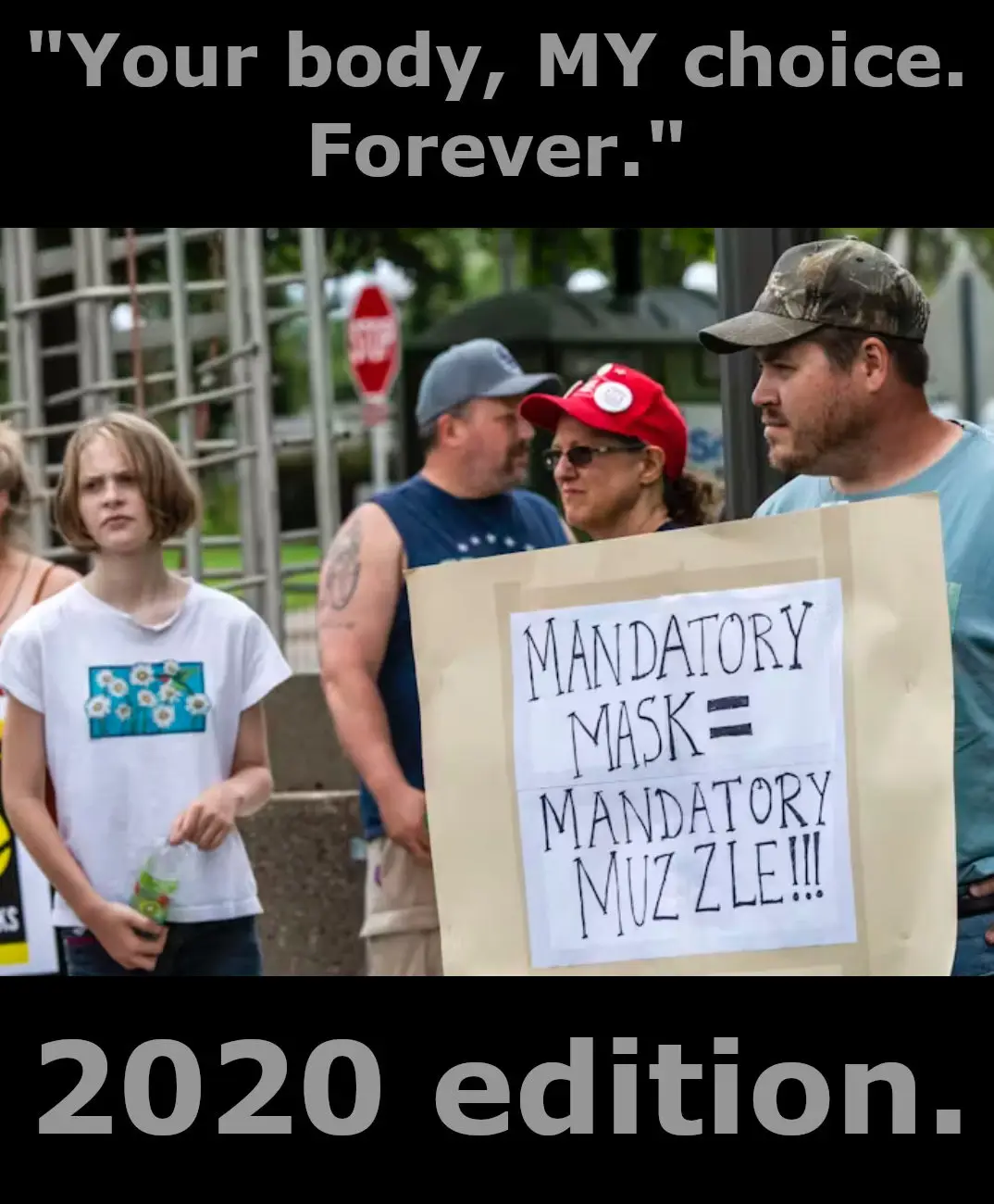 A photo of protesters at a 2020 rally, one holding a sign that reads 'MANDATORY MASK = MANDATORY MUZZLE!!!'. The image has…