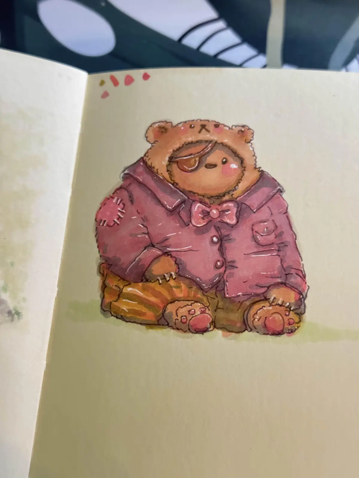 A watercolor illustration of a cute, chubby brown bear wearing a pink jacket with a bow tie and an eyepatch, sitting on a…