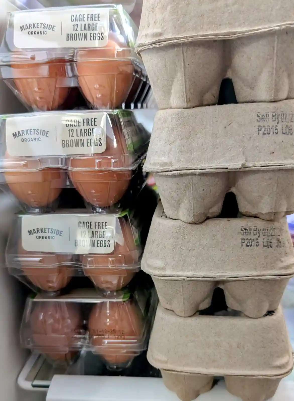 A grocery store egg shelf displays multiple clear plastic packages labeled 'MARKETSIDE ORGANIC CAGE FREE 12 LARGE BROWN…