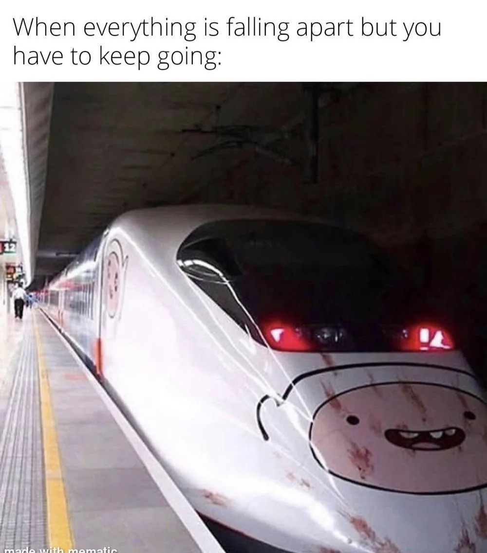A high-speed train, appearing to be in a tunnel or station, has a cartoon face painted on its front that looks distressed or…