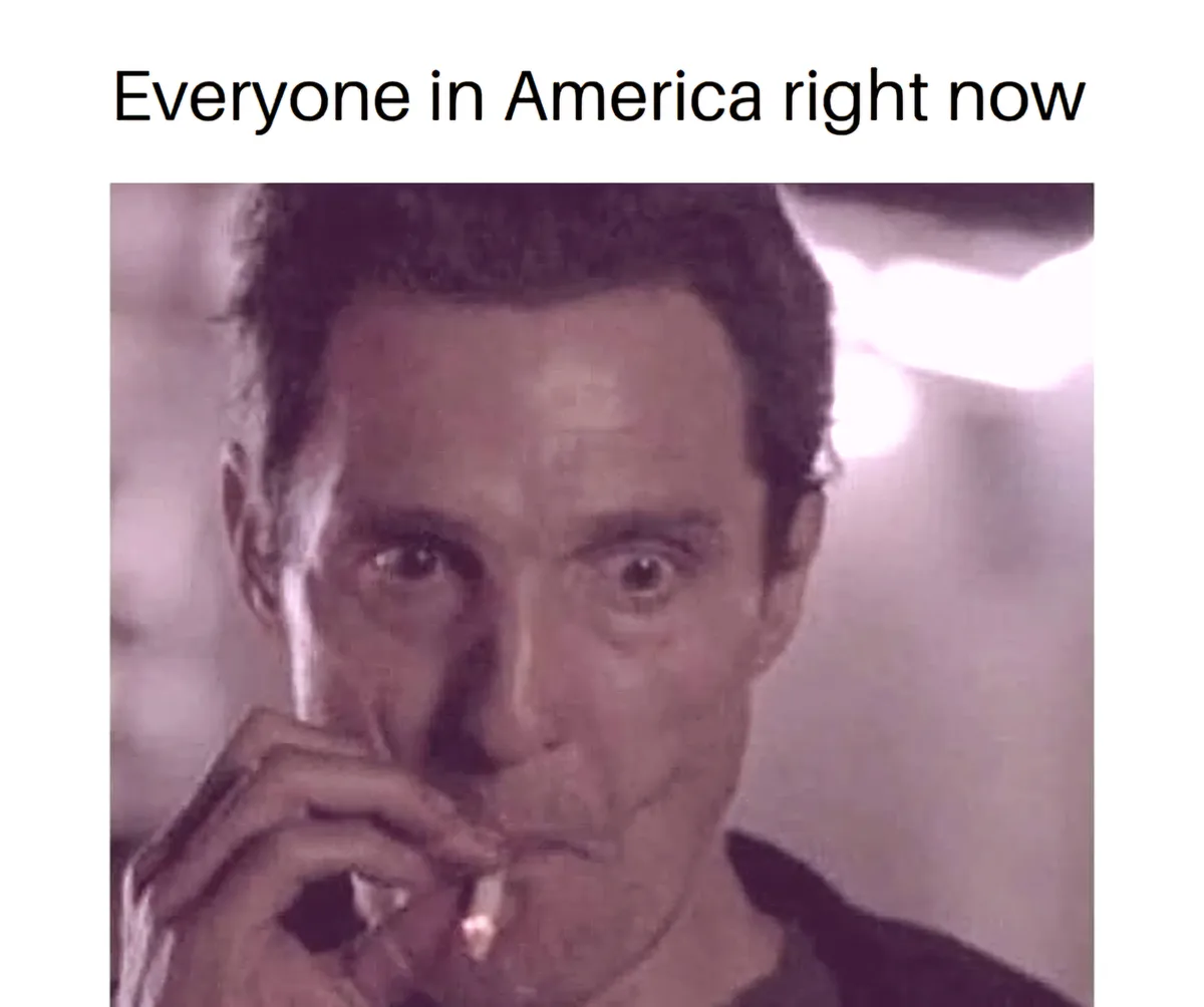 A grainy, purple-tinted image shows a man with wide, startled eyes staring directly at the camera while holding a cigarette…