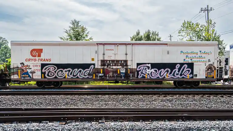 A white refrigerated train car with 'CRYO-TRANS' branding and the slogan 'Protecting Today's Perishables For Tomorrow' is…