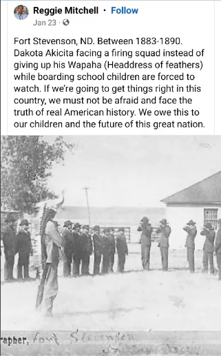 A historical black-and-white photo shows a man standing before a line of soldiers holding rifles, with a crowd of onlookers…