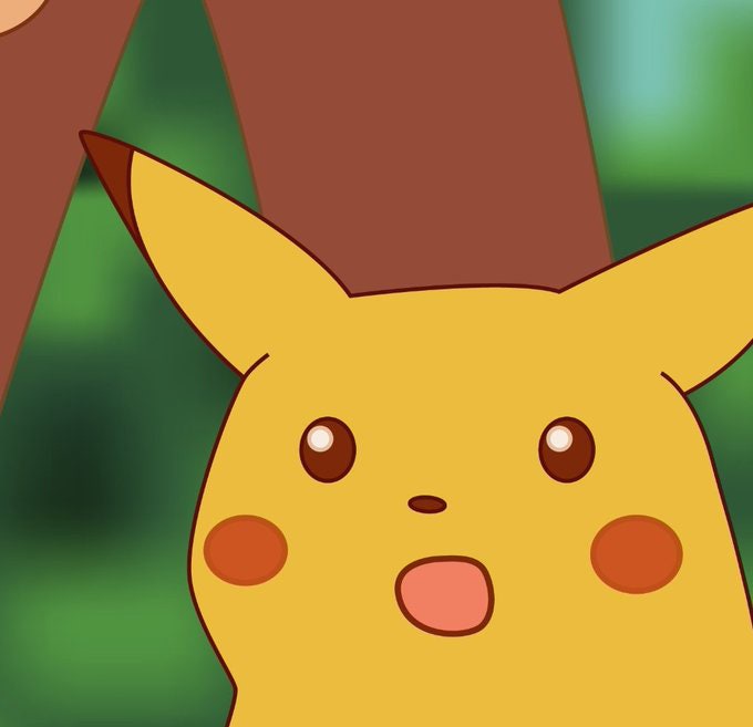 A close-up of the Pokémon Pikachu with a shocked expression, mouth open and eyes wide, set against a blurred green and brown…