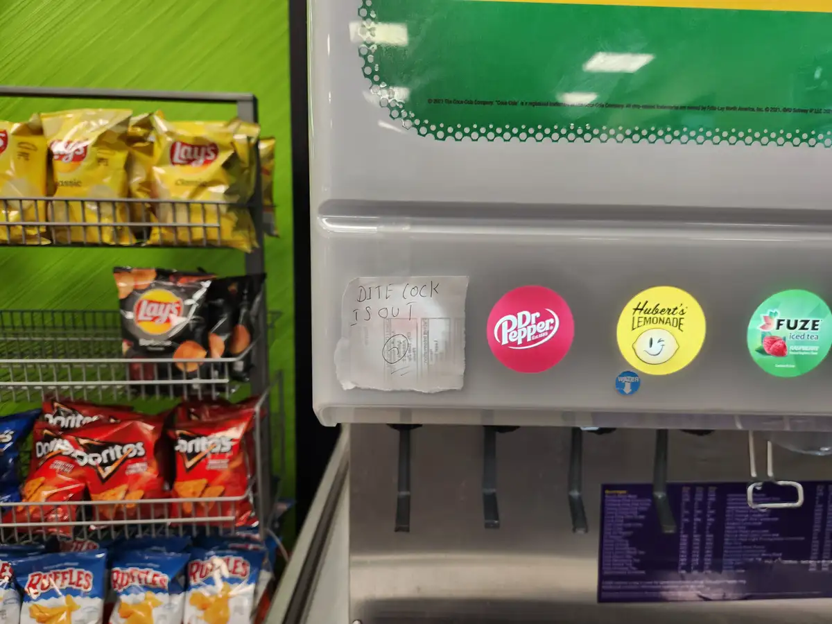 A close-up photo of a beverage dispenser with Dr Pepper, Hubert's Lemonade, and Fuze iced tea buttons, next to a handwritten…