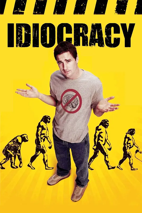 A man in a grey t-shirt with a red circle and slash over a brain graphic stands with arms outstretched against a bright…