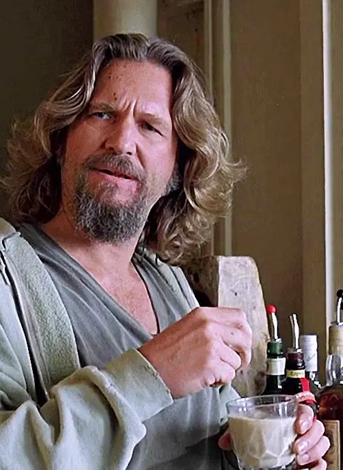 A six-panel grid shows actor Jeff Bridges as the Dude from 'The Big Lebowski' stirring a creamy drink with a straw. In each…