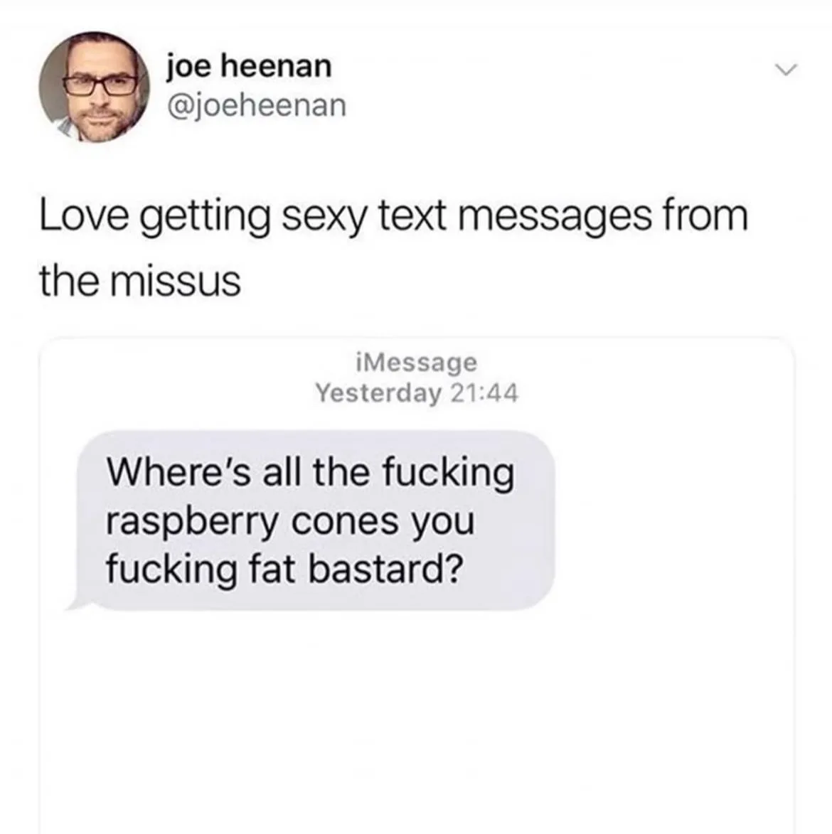 A screenshot of a tweet by Joe Heenan showing his tweet 'Love getting sexy text messages from the missus' followed by an…