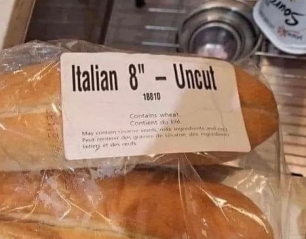A loaf of bread in plastic packaging has a label that reads 'Italian 8" - Uncut' and lists allergens. The label also…
