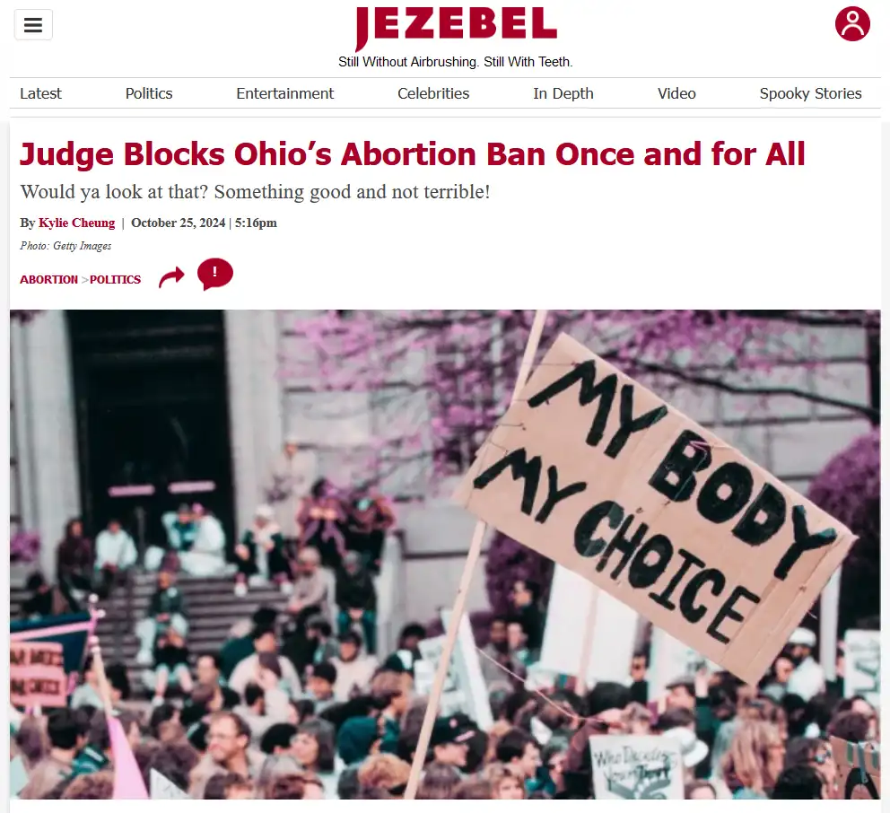 A screenshot of a Jezebel news article about a judge blocking Ohio's abortion ban, featuring a protest photo with a…