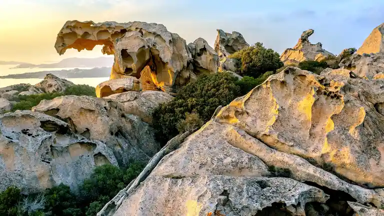A 350-foot-high stone formation, Roccia dell'Orso (Bear Rock), resembles a fierce creature watching over the sea. For…