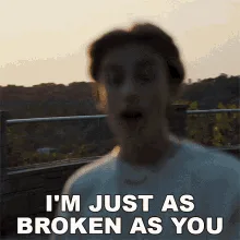 A six-panel image grid shows a young man in a white t-shirt and chain, filmed outdoors during golden hour. In each panel, he…