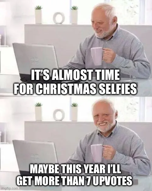 A two-panel meme featuring a man with white hair and a beard sitting at a desk with a laptop and holding a mug. In the top…