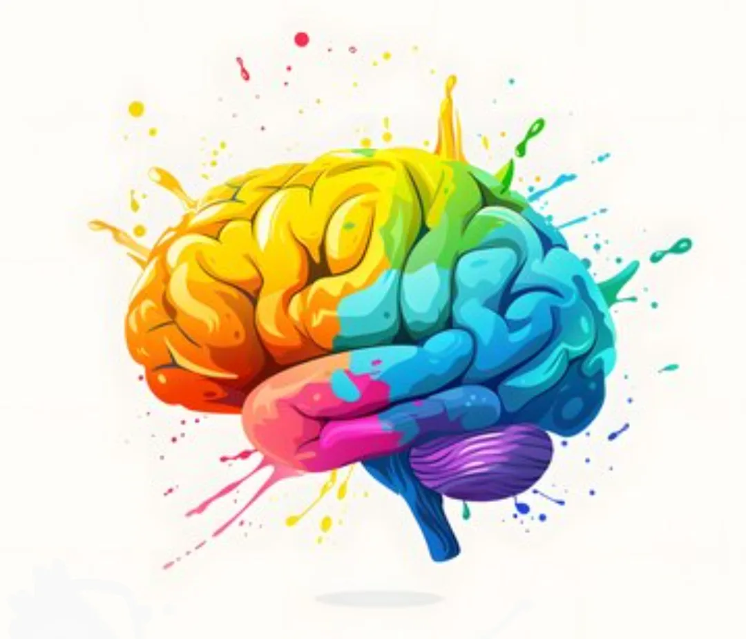 A stylized illustration of a human brain painted with vibrant rainbow colors, featuring splashes and drips of paint across…
