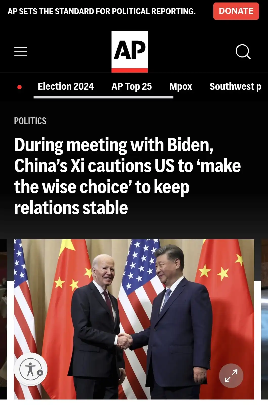 An AP news article screenshot shows U.S. President Joe Biden and Chinese President Xi Jinping shaking hands in front of…