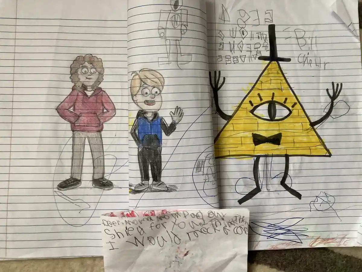 A child's notebook shows three hand-drawn characters: a girl in a red hoodie, a boy in a blue vest waving, and Bill Cipher…