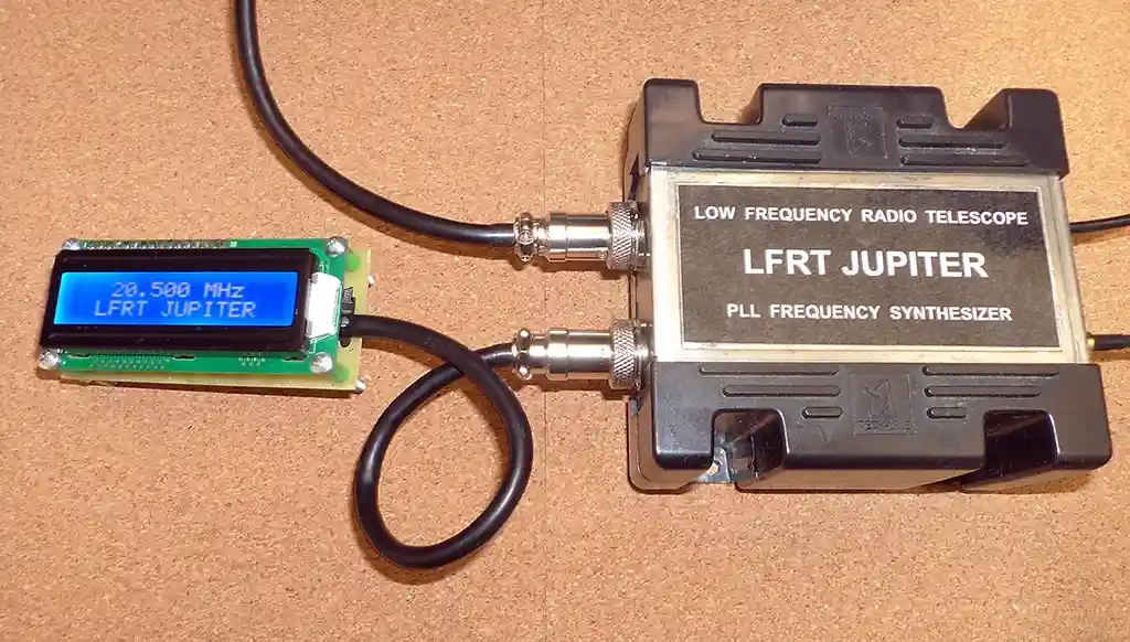 A low-frequency radio telescope labeled 'LFRT JUPITER' is connected via coaxial cables to a small circuit board with a blue…