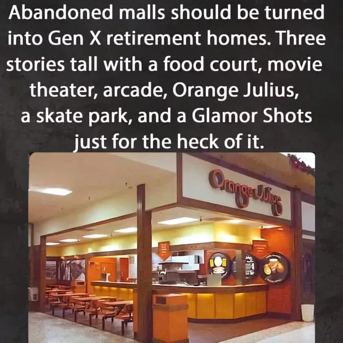 The image shows the interior of a mall food court featuring an Orange Julius juice bar with wooden tables and chairs. The…