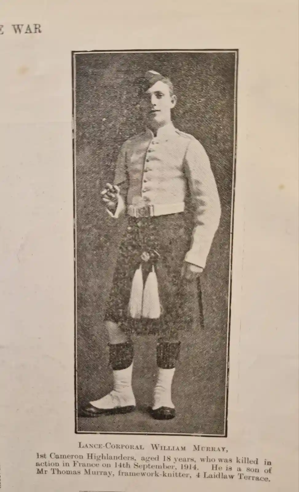 A vintage black-and-white newspaper clipping shows a formal portrait of a young man in a Scottish military uniform…