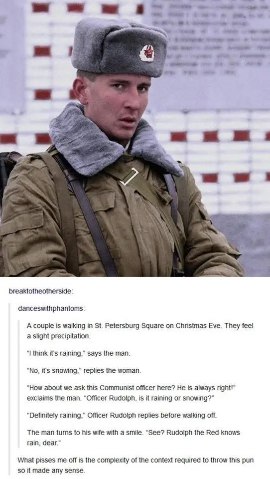 A man in a Soviet-style military uniform with a fur-lined collar and a grey ushanka hat looks surprised or confused. The…