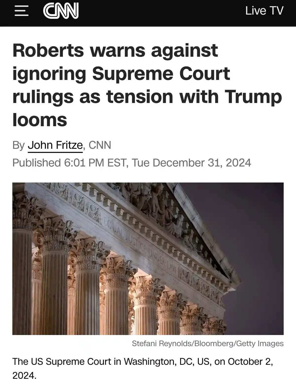 A screenshot of a CNN news article with a headline about Roberts warning against ignoring Supreme Court rulings amid tension…