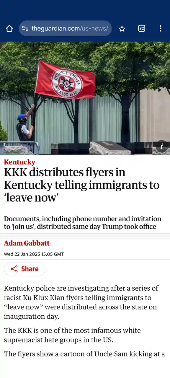 A screenshot of a The Guardian news article shows a person in a blue bandana and black vest holding a red flag with the…